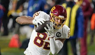 Washington Football Team tight end Logan Thomas (82) hauls in a 15-yard touchdown pass from quarterback Alex Smith during the second half of an NFL football game against the Pittsburgh Steelers, Monday, Dec. 7, 2020, in Pittsburgh. (AP Photo/Keith Srakocic)