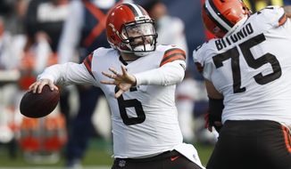 Cleveland Browns quarterback Baker Mayfield (6) passes against the Tennessee Titans in the first half of an NFL football game Sunday, Dec. 6, 2020, in Nashville, Tenn. (AP Photo/Wade Payne)
