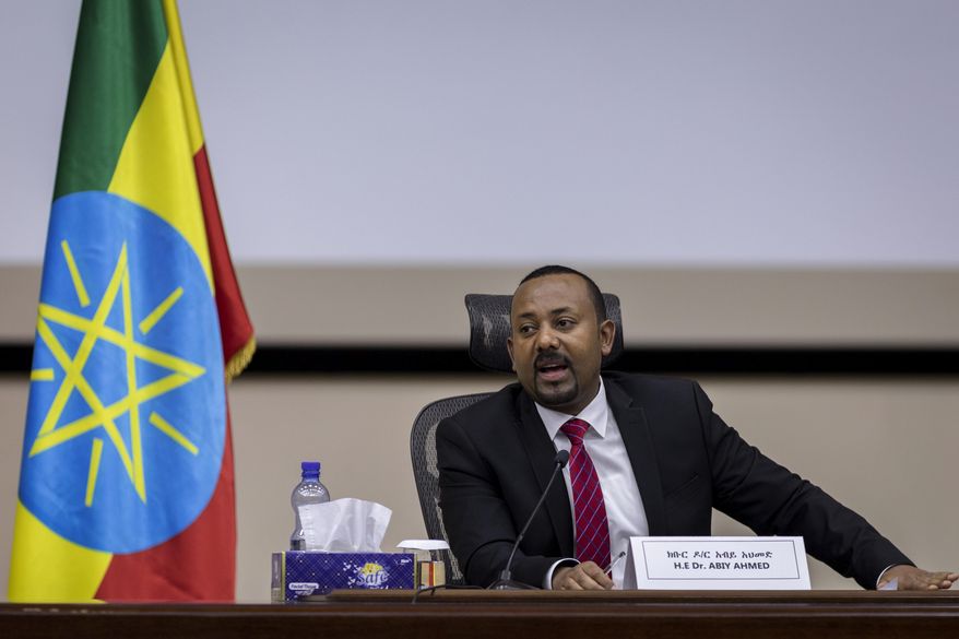 Ethiopia&#39;s Prime Minister Abiy Ahmed responds to questions from members of parliament at the prime minister&#39;s office in the capital Addis Ababa, Ethiopia Monday, Nov. 30, 2020. The fugitive leader of Ethiopia&#39;s defiant Tigray region on Monday called on Prime Minister Abiy Ahmed to withdraw troops from the region as he asserted that fighting continues &amp;quot;on every front&amp;quot; two days after Abiy declared victory. (AP Photo/Mulugeta Ayene)