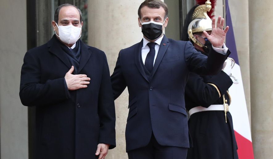 French President Emmanuel Macron, right, and Egyptian President Abdel-Fattah el-Siss gesture upon el-Sissi arrival at the Elysee palace, Monday, Dec. 7, 2020 in Paris. Egyptian President Abdel-Fattah el-Sissi is paying a state visit to France for talks on fighting terrorism, the conflict in Libya and other regional issues, amid criticism from human rights groups over the Egyptian leader&#39;s crackdown on dissent. (AP Photo/Michel Euler)