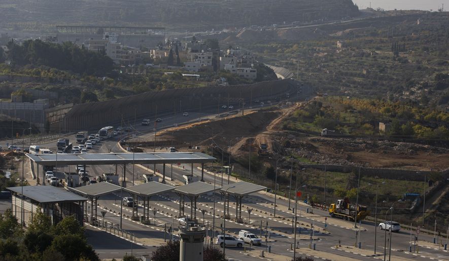 Roadworks expand a road to Israeli settlements inside the West Bank, near the city of Bethlehem, Sunday, Nov. 29, 2020. In years to come, Israelis will be able to commute into Jerusalem and Tel Aviv from settlements deep inside the West Bank via highways, tunnels and overpasses that cut a wide berth around Palestinian towns. Rights groups say the new roads that are being built will set the stage for explosive settlement growth, even if President-elect Joe Biden&#39;s administration somehow convinces Israel to curb its housing construction. (AP Photo/Majdi Mohammed)