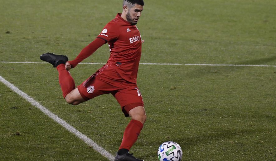 Toronto FC&#39;s Alejandro Pozuelo takes a shot on goal during overtime of the team&#39;s MLS soccer playoff match against Nashville SC, Tuesday, Nov. 24, 2020, in East Hartford, Conn. (AP Photo/Jessica Hill)