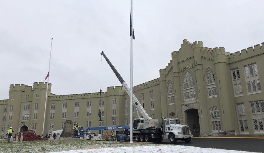 Crews lift a statue of Confederate Gen. Thomas &amp;quot;Stonewall&amp;quot; Jackson from its pedestal on the campus of the Virginia Military Institute on Monday, Dec. 7, 2020, in Lexington, Va. The  military college began work Monday to remove the prominent statue, an effort initiated this fall after allegations of systemic racism roiled the school.(AP Photo/Sarah Rankin)