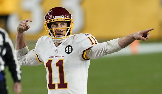 Washington Football Team quarterback Alex Smith (11) calls a play during the second half of an NFL football game against the Pittsburgh Steelers, Monday, Dec. 7, 2020, in Pittsburgh. (AP Photo/Keith Srakocic)