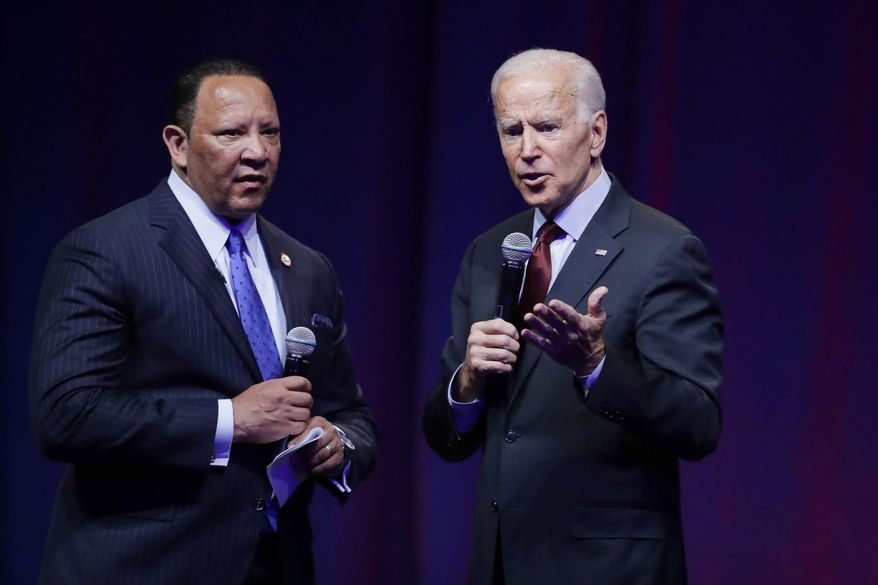Democratic presidential candidate and former Vice President Joe Biden, right, gestures while speaking as Marc Morial, president of the National Urban League, listens during the National Urban League Conference, Thursday, July 25, 2019, in Indianapolis. (AP Photo/Darron Cummings) **FILE**