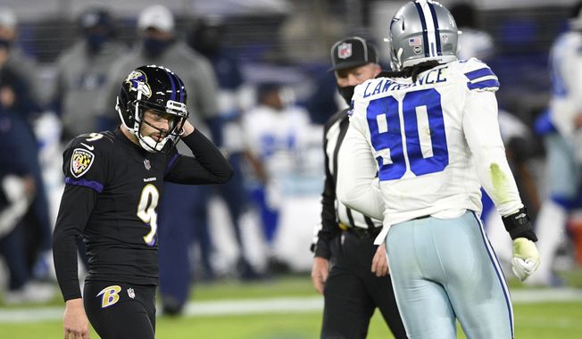 Baltimore Ravens kicker Justin Tucker (9) reacts after missing a field goal against the Dallas Cowboys during the first half of an NFL football game, Tuesday, Dec. 8, 2020, in Baltimore. (AP Photo/Nick Wass)