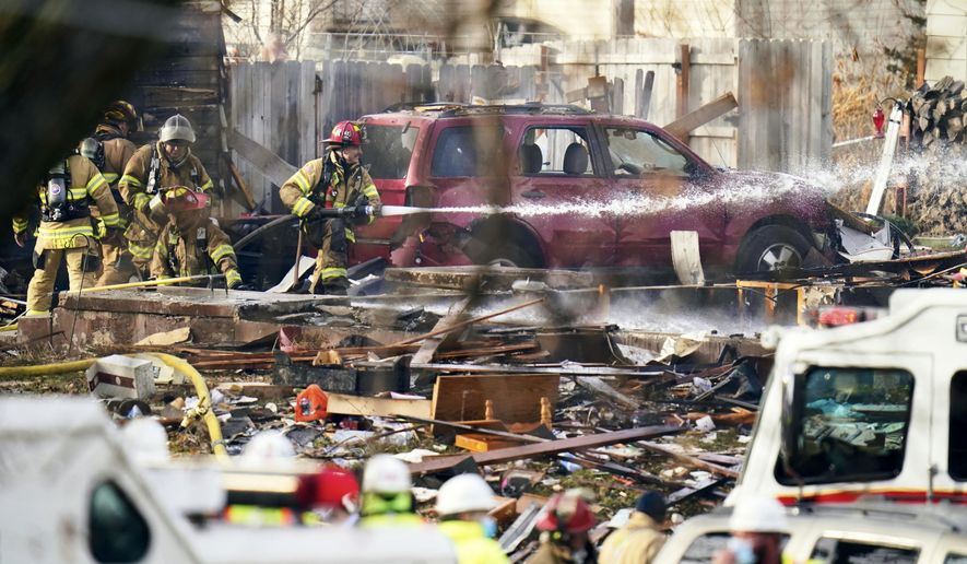 Firefighters work the scene of a deadly explosion that leveled a home in Omaha, Neb., Tuesday, Dec. 8, 2020. (AP Photo/Nati Harnik)