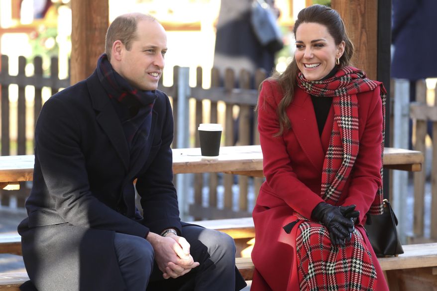 Britain's Prince William and Kate Duchess of Cambridge talk to members of the public at Cardiff Castle on Tuesday Dec. 8, 2020, in Cardiff, Wales. Prince William and Kate Duchess of Cambridge are undertaking a short tour of the UK by train ahead of the Christmas holidays to pay tribute to the inspiring work in local communities. (Chris Jackson/Pool via AP)