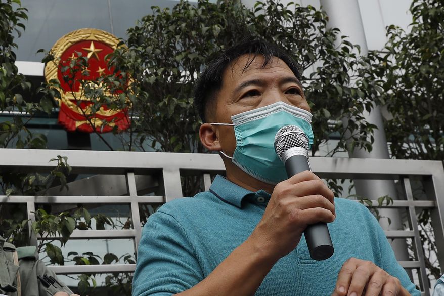 In this Friday, May 22, 2020, photo, pro-democracy lawmaker Wu Chi-wai, speaks during a protest at the Chinese central government&#39;s liaison office in Hong Kong. Hong Kong police on Tuesday arrested eight pro-democracy activists over their role in an unauthorized protest last summer, widening a crackdown on dissent in semi-autonomous Hong Kong. (AP Photo/Kin Cheung)