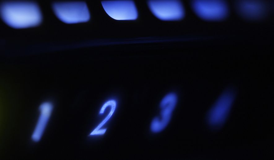FILE - This file photo shows an LED-illuminated wireless router in Philadelphia. Researchers at a cybersecurity firm say they have identified vulnerabilities in software widely used by millions of connected devices...flaws that could be exploited by hackers to penetrate business and home computer networks and disrupt them. Potentially affected devices from an estimated 150 manufacturers range from networked thermometers to “smart” plugs and printers to office routers and healthcare appliances to components of industrial control systems. (AP Photo/Matt Rourke, File)