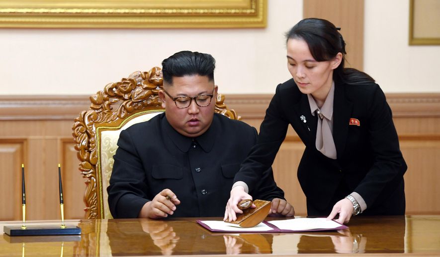 In this Sept. 19, 2018, file photo, Kim Yo-jong, right, helps her brother North Korean leader Kim Jong-un sign a joint statement following the summit with South Korean President Moon Jae-in at the Paekhwawon State Guesthouse in Pyongyang, North Korea. (Pyongyang Press Corps Pool via AP, File)
