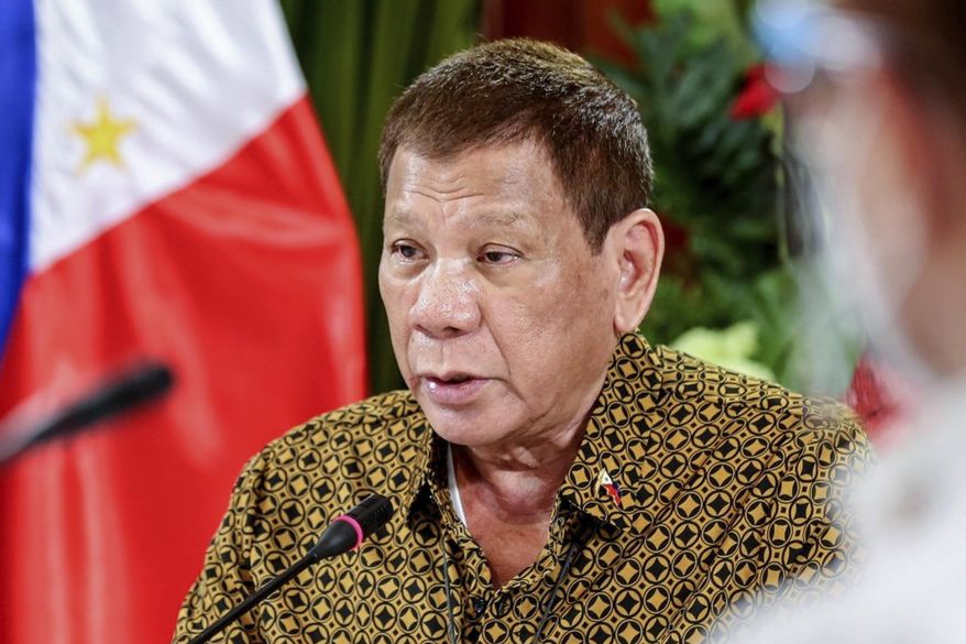 FILE - In this Sept. 28, 2020, file photo provided by the Malacanang Presidential Photographers Division, Philippine President Rodrigo Duterte talks with members of the Inter-Agency Task Force on the Emerging Infectious Diseases at the Malacanang presidential palace in Manila, Philippines. Duterte has ruled out any cease-fire or resumption of long-stalled peace talks with communist guerrillas and renewed a vow to destroy the insurgents in his last two years in office. (Richard Madelo/Malacanang Presidential Photographers Division via AP, File)