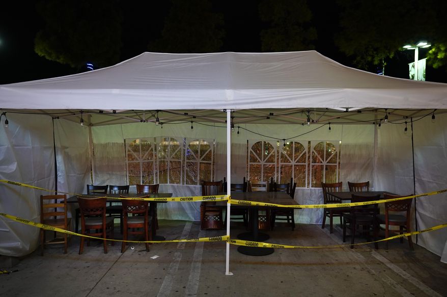 A closed outdoor dinning space is in the parking lot of a shopping mall in Rowland Heights, Calif., Monday, Dec. 7, 2020. The vast region of Southern California went into a lockdown Monday in an effort to curb spiraling coronavirus infections and hospitalizations. (AP Photo/Jae C. Hong)