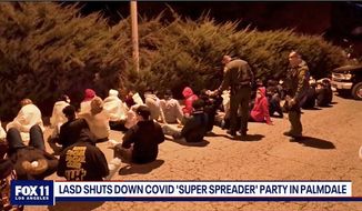 This photo from video provided by Fox11 Los Angeles shows some of the people arrested at a party in the high desert city of Palmdale, Calif., overnight Saturday to Sunday, Dec. 6, 2020. Officials say Los Angeles County deputies arrested nearly 160 people, many of whom were not wearing masks, who attended an illegal &amp;quot;super-spreader&amp;quot; party over the weekend despite surging coronavirus cases. Authorities announced Tuesday, Dec. 8, 2020 that the party in Palmdale resulted in the arrests of 158 people, 35 of whom were juveniles. Deputies found six weapons at the home and were able to rescue a 17-year-old human trafficking victim. KTTV Fox 11 first reported the party and arrests. (Fox11 Los Angeles via AP)