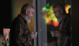 This image released by Netflix shows George Clooney in a scene from &amp;quot;The Midnight Sky.&amp;quot; (Philippe Antonello/Netflix via AP)
