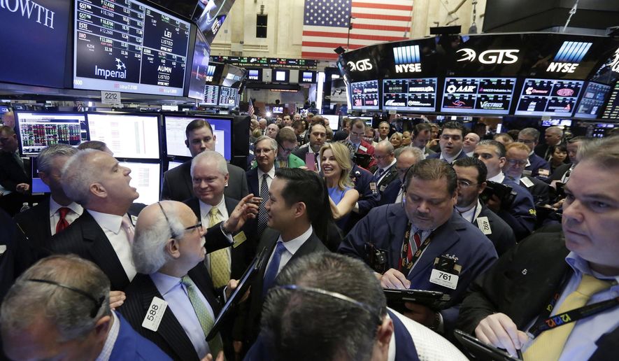 FILE - New York Stock Exchange floor governor Rudy Maas, left, calls out prices during the IPO of MGM Growth Properties on the floor of the NYSE, Wednesday, April 20, 2016. Wall Street has rolled out the welcome mat for companies going public this year, boosting proceeds from initial public offerings to the highest level in six years. Companies that have gone public this year have averaged a return of 53.8% above their IPO price, including a return of 23.4% after their first day of trading, according to Renaissance Capital, an IPO research provider. (AP Photo/Richard Drew, file)