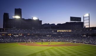 FILE - In this May 21, 2015, file photo, the St. Paul, Minn., skyline is visible beyond CHS Field as the St. Paul Saints hold their baseball season opener against the Fargo-Moorhead RedHawks at the new stadium. Major League Baseball went through with its plan to cut to 120 farm teams. As part of the reorganization, the Saints, which had been an independent team, will become the Triple-A team of the Minnesota Twins. (Aaron Lavinsky/Star Tribune via AP, File)