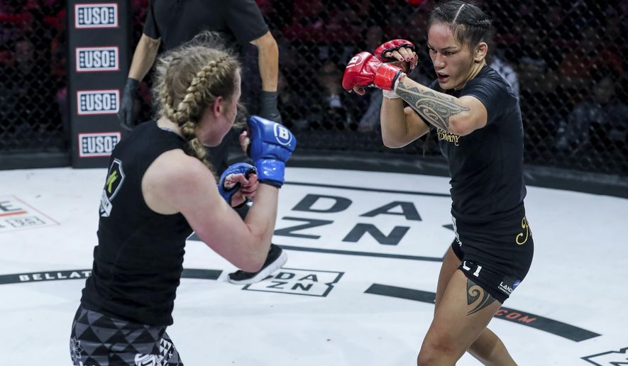 Ilima-Lei Macfarlane, right, battles with Kate Jackson during Bellator 236, Saturday, Dec. 21, 2019 in Honolulu. Bellator flyweight champion Ilima-Lei Macfarlane faces the most daunting challenge of her career Thursday, Dec. 10, 2020 against unbeaten contender Juliana Velasquez. (Lucas Noonan/MMA via AP)