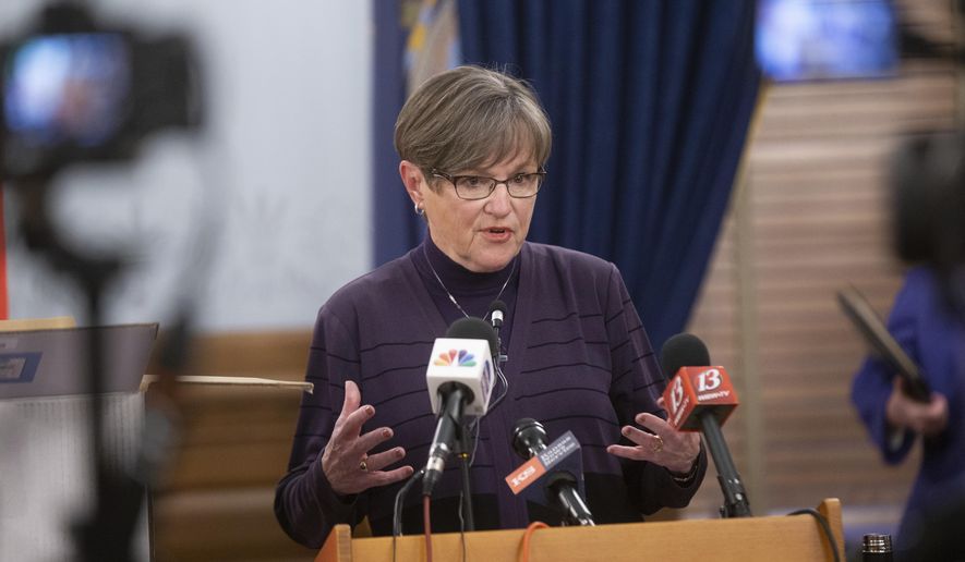 Kansas Gov. Laura Kelly gives updates to the free testing strategies during a news conference, Wednesday, Dec. 9, 2020 at the Statehouse in Topeka, Kan. (Evert Nelson/The Topeka Capital-Journal via AP)