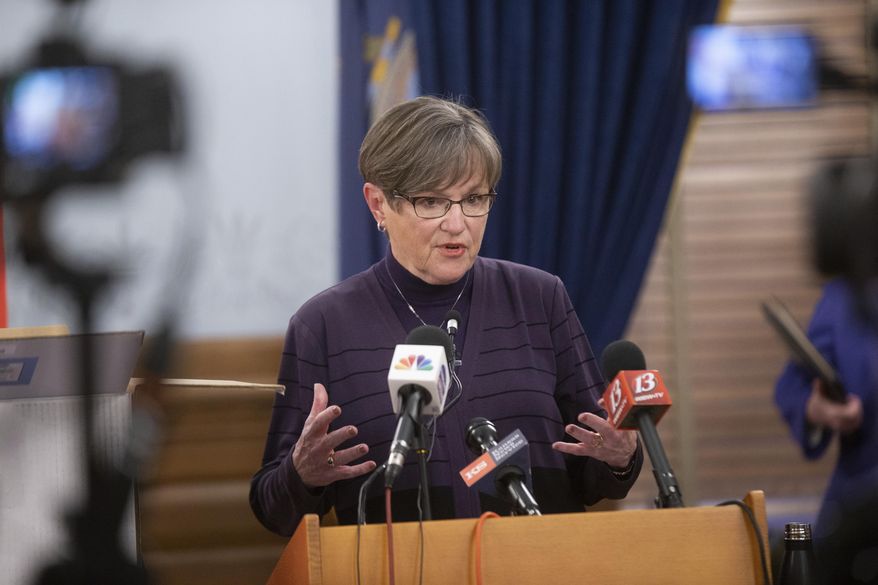 Kansas Gov. Laura Kelly gives updates to the free testing strategies during a news conference, Wednesday, Dec. 9, 2020 at the Statehouse in Topeka, Kan. (Evert Nelson/The Topeka Capital-Journal via AP)