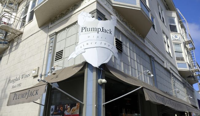 FILE - This Oct. 22, 2018, file photo shows the Plumpjack Wine &amp;amp; Spirits store in San Francisco, part of the Plumpjack Group collection of wineries, bars, restaurants, hotels and liquors stores. Companies affiliated with Gov. Gavin Newsom received nearly $3 million in loans designed to help small businesses survive the pandemic, more than eight times the amount originally reported, according to newly released information from the federal government. Nine businesses tied to Newsom&#x27;s PlumpJack Group split the nearly $3 million in loans through the Small Business Administration&#x27;s Paycheck Protection Program, according to new figures released last week. (AP Photo/Eric Risberg, File)