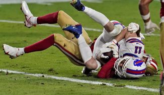 Buffalo Bills wide receiver Cole Beasley (11) scores a touchdown as San Francisco 49ers cornerback Richard Sherman defends during the first half of an NFL football game, Monday, Dec. 7, 2020, in Glendale, Ariz. (AP Photo/Ross D. Franklin)