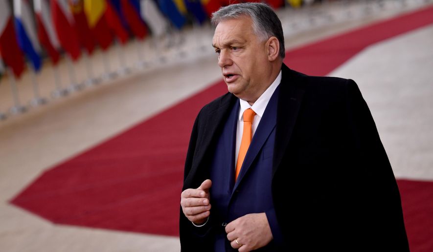 Hungary&#x27;s Prime Minister Viktor Orban speaks as he arrives for an EU summit at the European Council building in Brussels, Thursday, Dec. 10, 2020. European Union leaders meet for a year-end summit that will address anything from climate, sanctions against Turkey to budget and virus recovery plans. Brexit will be discussed on the sidelines. (John Thys, Pool via AP)