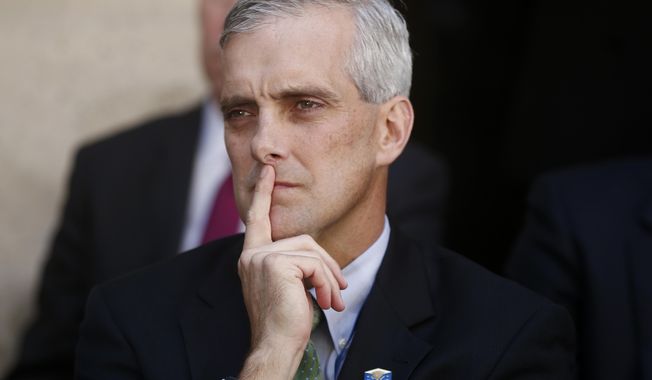 In this Oct. 28, 2013, file photo, White House Chief of Staff Denis McDonough listens as President Barack Obama speaks at FBI Headquarters in Washington. President-elect Joe Biden is nominating McDonough as secretary of the Department of Veterans Affairs. The sprawling agency has presented organizational challenges for both parties over the years. Biden is continuing to stockpile his administration with prominent alumni of the Obama administration.  (AP Photo/Charles Dharapak, File)