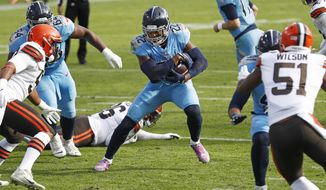 Tennessee Titans running back Derrick Henry (22) carries the ball against the Cleveland Browns in the second half of an NFL football game Sunday, Dec. 6, 2020, in Nashville, Tenn. (AP Photo/Wade Payne)