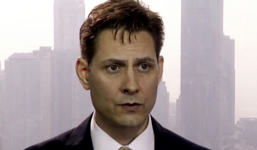 FILE - In this file image made from March 28, 2018, video, Michael Kovrig, an adviser with the International Crisis Group, a Brussels-based non-governmental organization, speaks during an interview in Hong Kong. China&#39;s Foreign Ministry said Thursday, Dec. 10, 2020 that two Canadians, including Kovrig, held for two years in a case linked to a Huawei executive have been indicted and put on trial, but gave no details. (AP Photo, File)
