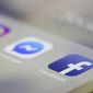 In this March 13, 2019, photo, Instagram, Messenger and Facebook apps are displayed on an iPhone in New York. (AP Photo/Jenny Kane) **FILE**