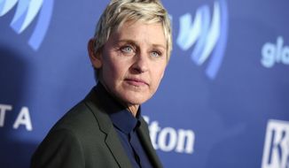 FILE - Ellen DeGeneres arrives at the 26th Annual GLAAD Media Awards in Beverly Hills, Calif., on March 21, 2015. DeGeneres said she has tested positive for COVID-19 but is “feeling fine right now.” The producer of her daytime talk show says production has been put on hold until January. (Photo by Richard Shotwell/Invision/AP, File)