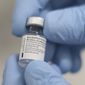 A vial of the Pfizer-BioNTech COVID-19 vaccine at the Royal Victoria Hospital, in Belfast, Tuesday, Dec. 8, 2020. The United Kingdom, one of the countries hardest hit by the coronavirus, is beginning its vaccination campaign, a key step toward eventually ending the pandemic. (Liam McBurney/Pool via AP)