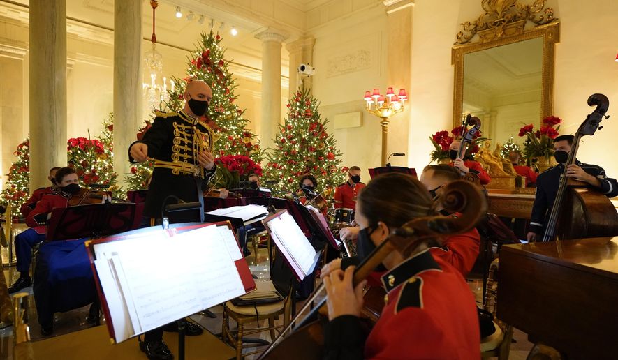 A U.S. Marine Corps band performs in the Entrance Hall of the White House during the 2020 Christmas preview, Monday, Nov. 30, 2020, in Washington. (AP Photo/Patrick Semansky)