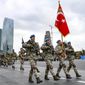 Members of a Turkish forces commando brigade take part in a military parade in which Turkey&#39;s President Recep Tayyip Erdogan and Azerbaijan&#39;s President Ilham Aliyev, looked on in Baku, Azerbaijan, Thursday, Dec. 10, 2020. The massive parade was held in celebration of the peace deal with Armenia over Nagorno-Karabakh that saw Azerbaijan reclaim much of the separatist region along with surrounding areas. (AP Photo)