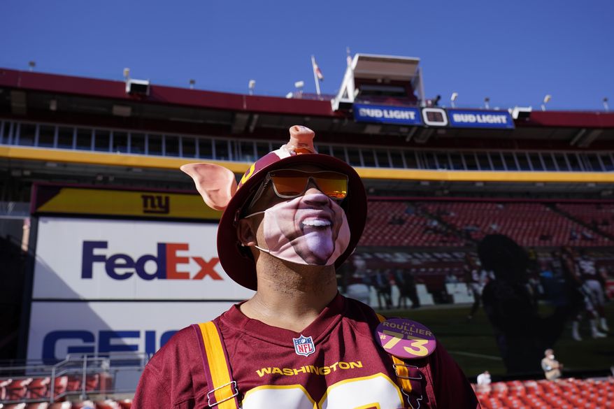 Fan Chris Bryant, from Staunton, Va., in seating area at FedEX Field before the start of an NFL football game between the New York Giants and Washington Football Team, Sunday, Nov. 8, 2020, in Landover, Md. (AP Photo/Susan Walsh)