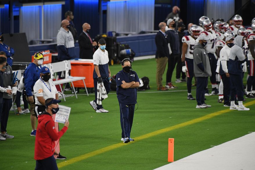 New England Patriots head coach Bill Belichick, center, looks on in the first half of an NFL football game against the Los Angeles Rams in Inglewood, Calif., Thursday, Dec. 10, 2020. (Keith Birmingham/The Orange County Register via AP)