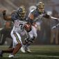 Navy quarterback Xavier Arline (7) rushes during the first half of an NCAA college football game against Army on Saturday, Dec. 12, 2020, in West Point, N.Y. (AP Photo/Adam Hunger)
