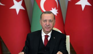 Turkey&#39;s President Recep Tayyip Erdogan talks during a joint news conference with Azerbaijan&#39;s President Ilham Aliyev, in Baku, Azerbaijan, Thursday, Dec. 10, 2020. Following the approval of European leaders Friday Dec. 11, 2020 of expanding sanctions against Ankara, Turkey called on the European Union to act as an &#39;honest mediator&#39; in its dispute with EU members Greece and Cyprus over the exploration of gas reserves in the Mediterranean. The leaders said early Friday that Turkey has &amp;quot;engaged in unilateral actions and provocations and escalated its rhetoric against the EU.&amp;quot;&amp;quot;(Turkish Presidency via AP, Pool)