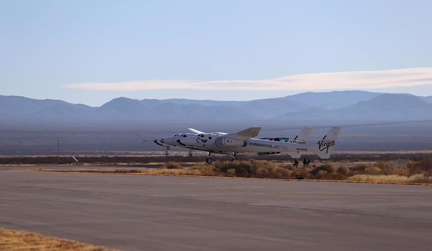 This photo provided by Virgin Galactic, Virgin Galactic&#x27;s SpaceShipTwo Unity, attached to mothership, VMS Eve, takes off on Saturday, Dec. 12, 2020 at Spaceport America in southern New Mexico.   Saturday morning’s test flight marks the third space flight overall for Virgin Galactic as the company looks to begin commercial flights next year.  (Virgin Galactic via AP)