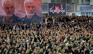 In this photo released by the official website of the office of the Iranian supreme leader, worshippers chant slogans during Friday prayers ceremony, as a banner show Iranian Revolutionary Guard Gen. Qassem Soleimani, left, and Iraqi Shiite senior militia commander Abu Mahdi al-Muhandis, who were killed in Iraq in a U.S. drone attack on Jan. 3, and a banner which reads in Persian: &amp;quot;Death To America, &amp;quot;at Imam Khomeini Grand Mosque in Tehran, Iran, Friday, Jan. 17, 2020. Iran&#39;s supreme leader said in his sermons President Donald Trump is a &amp;quot;clown&amp;quot; who only pretends to support the Iranian people but will &amp;quot;push a poisonous dagger&amp;quot; into their backs, as he struck a defiant tone in his first Friday sermon in Tehran in eight years. (Office of the Iranian Supreme Leader via AP)