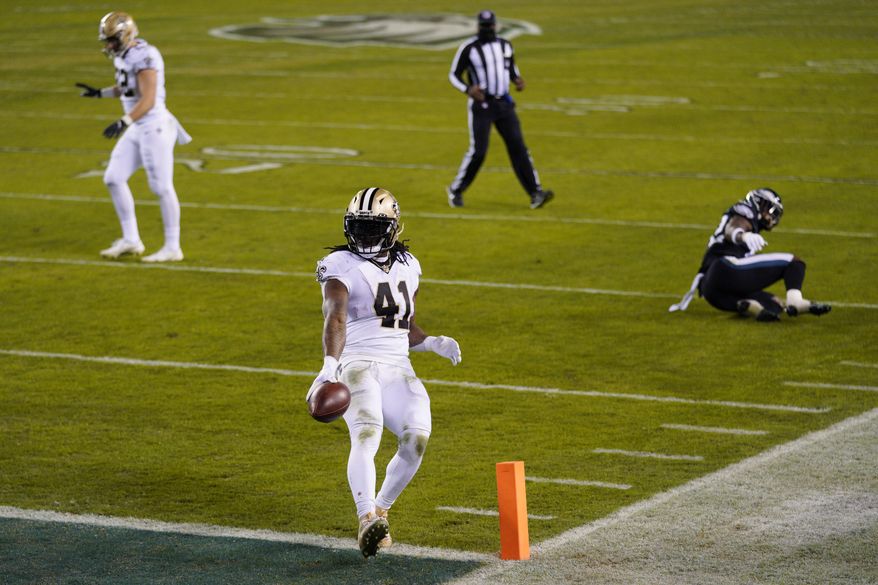 New Orleans Saints' Alvin Kamara runs for a touchdown during the second half of an NFL football game against the Philadelphia Eagles, Sunday, Dec. 13, 2020, in Philadelphia. (AP Photo/Chris Szagola)