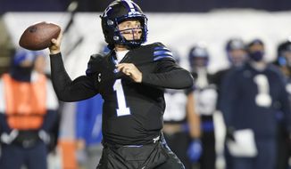 BYU quarterback Zach Wilson looks for a receiver during the first half of the team&#39;s NCAA college football game against San Diego State on Saturday, Dec. 12, 2020, in Provo, Utah. (AP Photo/George Frey, Pool)