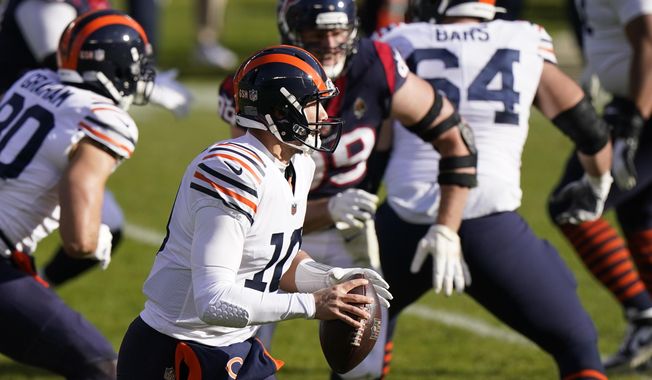 Chicago Bears quarterback Mitchell Trubisky (10) looks to throw during the first half of an NFL football game against the Houston Texans, Sunday, Dec. 13, 2020, in Chicago. (AP Photo/Nam Y. Huh)