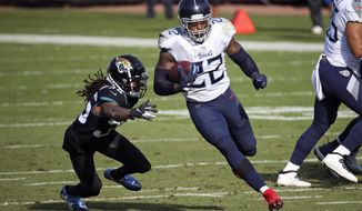 Tennessee Titans running back Derrick Henry (22) goes past Jacksonville Jaguars cornerback Sidney Jones for a 36-yard touchdown during the first half of an NFL football game, Sunday, Dec. 13, 2020, in Jacksonville, Fla. (AP Photo/Stephen B. Morton)