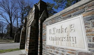 Duke University, which held in-person classes this semester, tested 6,000-plus undergraduates twice weekly for COVID-19 and reported a positivity rate well below 1%. (ASSOCIATED PRESS PHOTOGRAPHS)