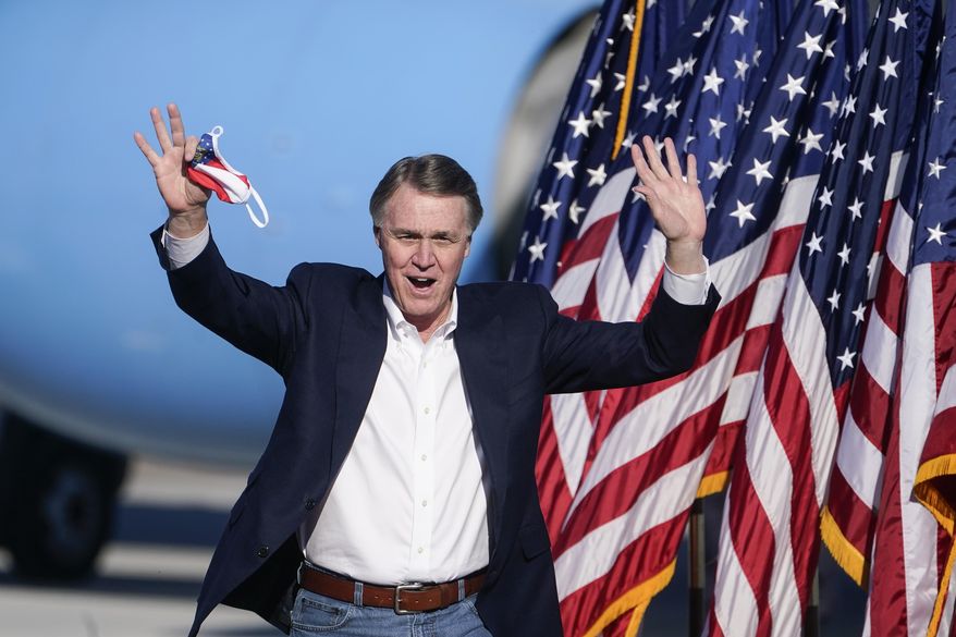 Sen. David Perdue, R-Ga., arrives to speak before Vice President Mike Pence during a &amp;quot;Save the Majority&amp;quot; rally on Thursday, Dec. 10, 2020, in Augusta, Ga. (AP Photo/John Bazemore)