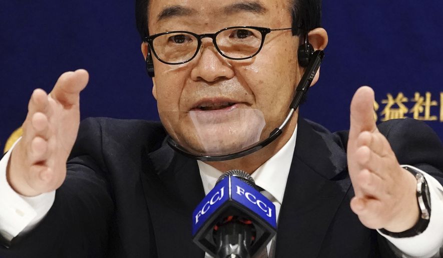 Nobutada Kuroiwa, mayor of Kusatsu, Gunma Prefecture speaks during a press conference at the Foreign Correspondents' Club of Japan in Tokyo Monday, Dec. 14, 2020. The mayor of the Japanese hot springs resort denied sexual assault allegations by a former town assemblywoman and justified her recall in a recent referendum. Kuroiwa told a news conference Monday that the recall of Shoko Arai had nothing to do with discrimination against women but was to protect from disgrace. (AP Photo/Eugene Hoshiko)