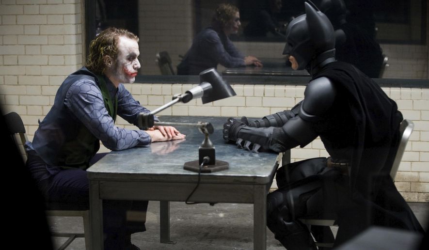 This image released by the Library of Congress shows Heath Ledger, left, and Christian Bale in a scene from the 2008 film "The Dark Knight." The film was added to the National Film Registry. (Warner Bros.-Library of Congress via AP)