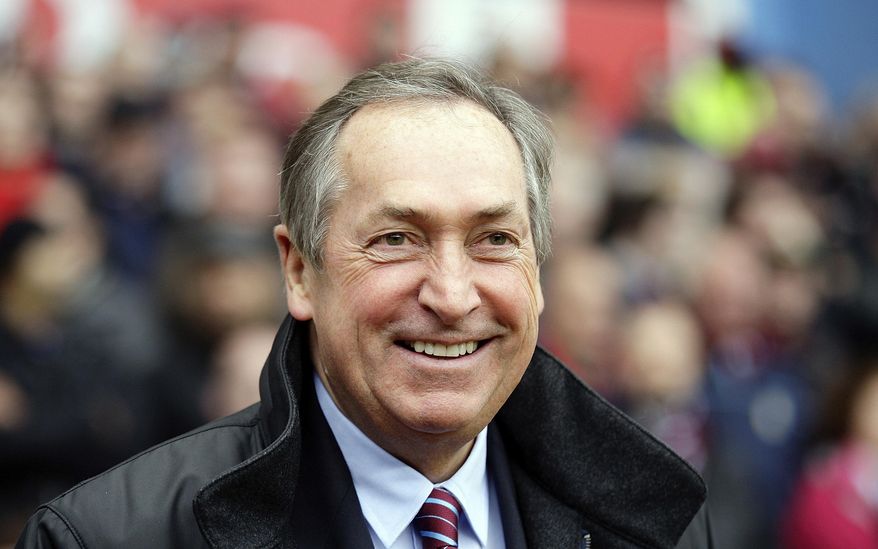 FILE - In this Sunday, Oct. 31, 2010 file photo, Aston Villa Gerard Houllier looks on before his team&#x27;s English Premier League soccer against Birmingham City at Villa Park stadium, Birmingham, England. Gerard Houllier, a Frenchman who won three titles in one season as coach of English club Liverpool, has died. He was 73. Liverpool announced the death on Twitter on Monday Dec. 14, 2020. French sports daily L’Equipe said Houllier died following heart surgery in France. (AP Photo/Simon Dawson, File)